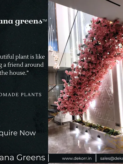 A beautiful plant is like having a friend around the house. This handmade pink flowering tree, set in a long planter, adds life and elegance to this modern home.