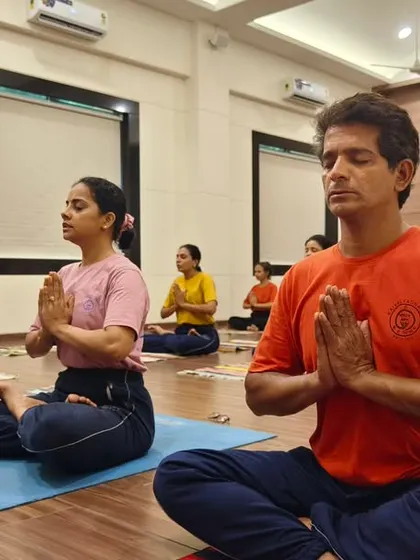 A glimpse into a session at our Mumbai center, where practitioners of all ages come together. We cultivate an environment of focus and discipline, where the goal is inner balance and mental clarity, guided by the principles of traditional yoga.