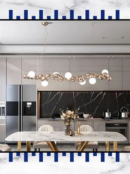 Experience dining in absolute elegance. This design, with its marble-topped table and modern bubble chandelier, encapsulates the essence of luxury.