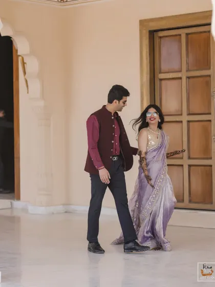 A candid walking shot of the couple during their Mehndi event at Anantara Jaipur.