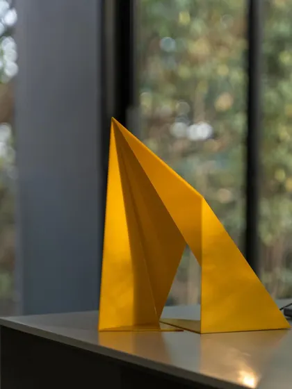 This is a scaled model of the "Yello" art installation. We use physical prototypes like this to study the geometry, structure, and visual impact of a design before fabrication, ensuring the final piece is true to our vision.
