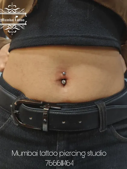 A professionally done belly piercing, looking clean and perfectly centered. We ensure every piercing is 100% safe and hygienic.