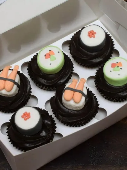 Who says you can't have sushi for dessert? I had a blast creating these quirky sushi-themed cupcakes. Each piece, from the shrimp nigiri to the maki rolls, is handcrafted from fondant and sits on a swirl of rich chocolate frosting.