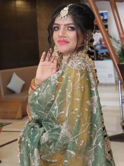 This Punjabi bride's look is all about grace. The soft, smoky eye and the intricately embroidered dupatta are perfectly balanced.