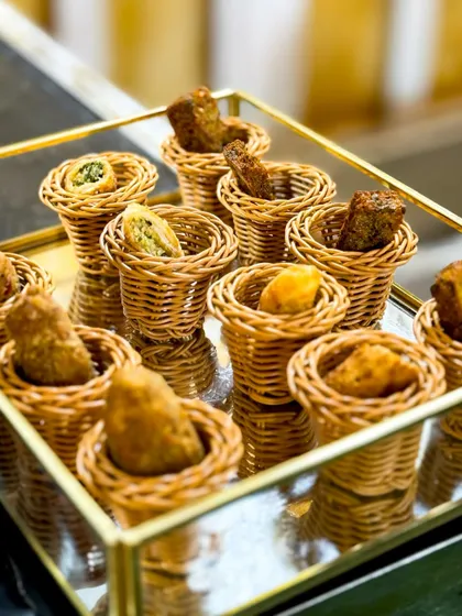 Snack attack! These bite-sized appetizers, served in adorable wicker baskets, are perfect for passing around during cocktail hour to keep the party vibe alive.