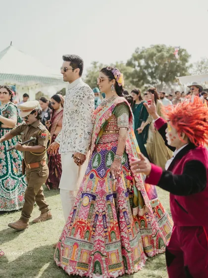 A fun and quirky entry with performers, adding a unique and memorable element to the celebration.