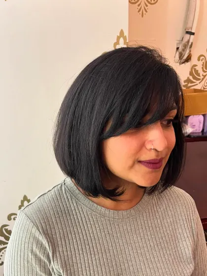 The side-swept bangs add a touch of softness.