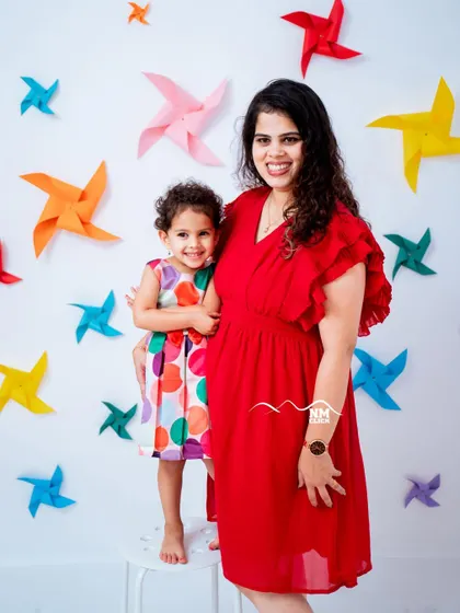 A colorful and happy mother daughter portrait to celebrate a third birthday. Our studio is equipped with a variety of vibrant backdrops and props to match any birthday theme you have in mind.