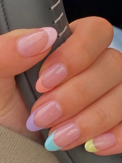 A client's photo of her gorgeous pastel French manicure. Each nail has a different soft-colored tip, creating a fun, rainbow-like effect that's subtle yet incredibly chic.