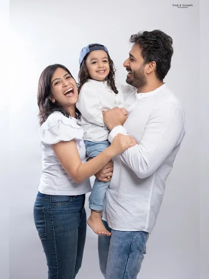 Love, laughter, and happiness. This candid family portrait captures a genuine moment of joy and connection.