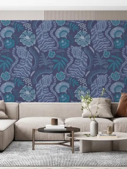 A stylish and modern wallpaper featuring a repeating pattern of tigers and botanicals in cool blue tones.