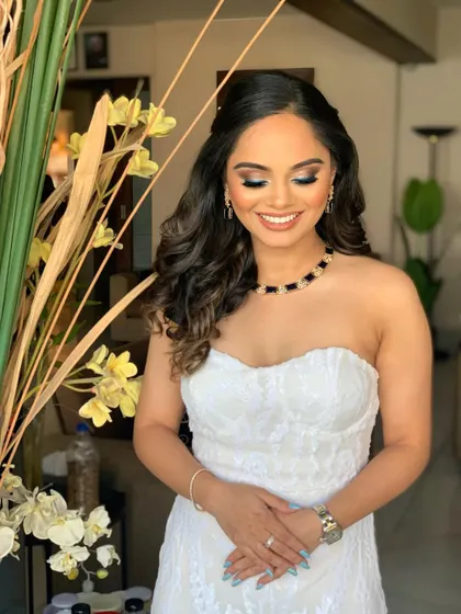 Stunning Priyanka for her Greece-themed engagement party. I created a smokey eye with a nude lip to complement her elegant white strapless dress.