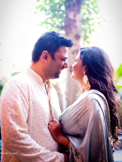 A bright and happy portrait from a Roka ceremony. The couple's joyful expressions and the beautiful backlighting create a warm and romantic feel.