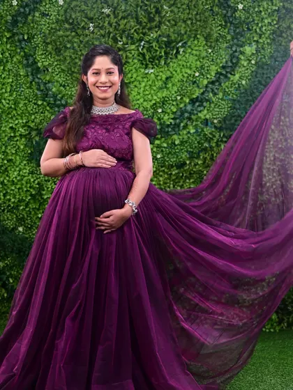 Capturing the beautiful flow of our designer gowns is part of the magic. This purple maternity gown comes with a long trail for those dramatic, memorable shots.