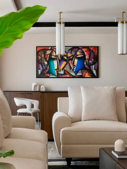 In the Parishram residence, we use art to define spaces. This vibrant, abstract painting adds a bold splash of color to the neutral living room palette.