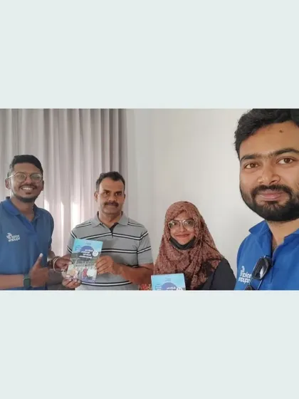 Our team with a couple holding our solar guide.