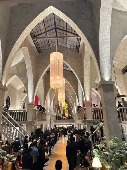The stunning architecture and packed crowd at the Atlantis grand launch. I have experience playing in unique and high-design venues, adding to the sophisticated atmosphere.