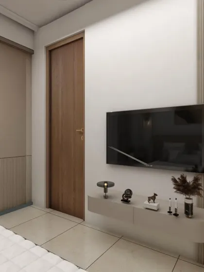 This minimalist bedroom design features a floating TV console and a handleless wardrobe with fluted detailing. The simple, clean lines help create a tranquil and uncluttered environment.