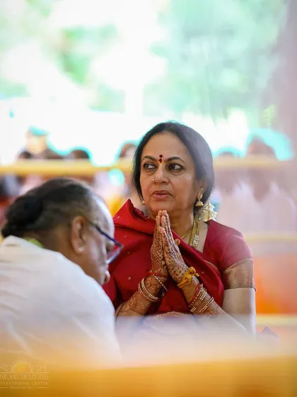A devotee in deep prayer during the Shat Chandi Homa. The powerful vibrations of the chants help to quiet the mind and open the heart.
