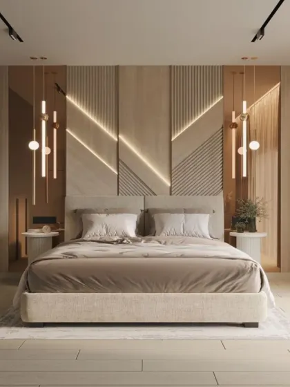 We designed this accent wall with geometric wood paneling and integrated diagonal lighting for a dynamic, modern effect. The neutral bedding and simple pendant lights ensure the wall remains the hero of the room.