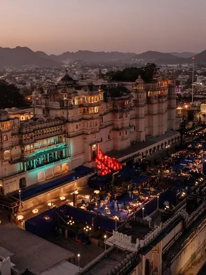 The entire city palace complex in Udaipur, viewed from above during a Sangeet we planned. This shot captures the immense scale and electric atmosphere of the celebration.