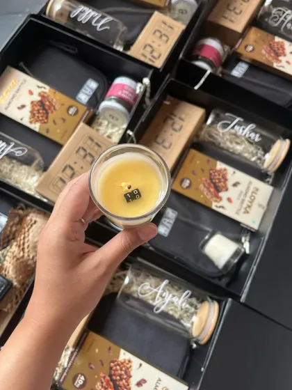 For a corporate client's 10th anniversary, I created these special hampers featuring a candle with a hidden message that reveals itself as it burns. It's these little details that turn a corporate gift into a memorable experience.