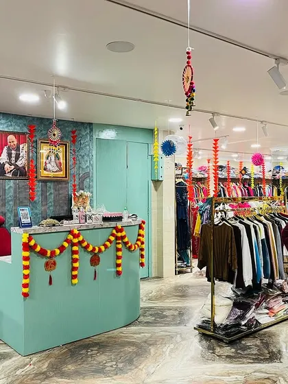 A view of the decorated checkout counter, complete with marigold garlands and traditional artwork.