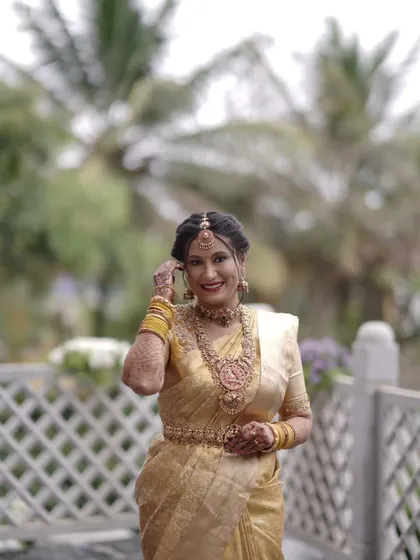 A candid moment of happiness. You can see how the full set, including the maang tikka and waist belt, comes together to complete her traditional bridal attire.