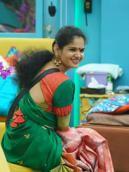 Chaitra Kundapura from Bigg Boss Kannada 11, looking cheerful in a green and pink saree with a custom blouse we designed for her.
