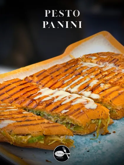My Pesto Panini is a gourmet sandwich, pressed until golden and crisp. It's generously filled with fresh basil pesto, melted cheese, and garden vegetables for a perfect bite.