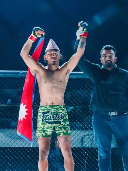 Raising the hand of a victorious fighter in Nepal. As a referee, ensuring a fair fight and seeing the joy of a win is a great feeling.