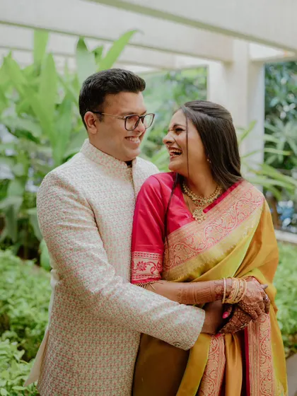 A beautiful, happy portrait of a couple in traditional attire, embracing and laughing. This shot perfectly captures the joy and excitement of their engagement session.
