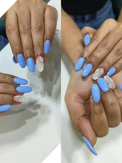 A lovely set of sky blue nails with accent nails featuring delicate, embedded heart glitter. This shows how I can incorporate different elements for a sweet and subtle design.