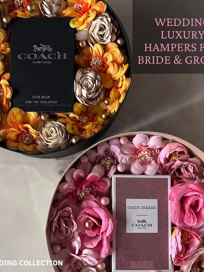 A luxurious "his and hers" wedding hamper for the bride and groom. It features Coach perfumes for him and her, beautifully presented in floral-decorated boxes.