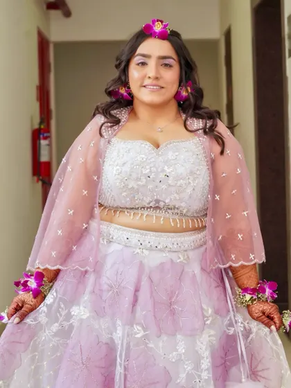 Another full-length shot showing her radiant smile and the subtle makeup that enhances her natural glow.
