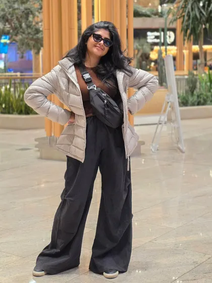 Posing at the airport, excited for the journey ahead. Traveling for music is a dream come true.