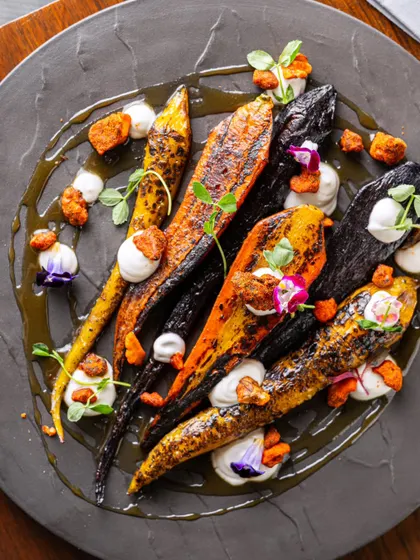 A gourmet dish of roasted heritage carrots. This demonstrates our ability to shoot for fine-dining concepts, focusing on artistic plating and unique ingredients.