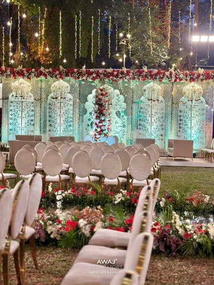 The aisle view of the Nikah ceremony, with floral arrangements lining the path and leading to the beautifully decorated main stage.