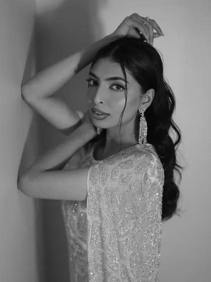 A timeless black and white version of the previous shot, emphasizing the gown's classic beauty and texture.