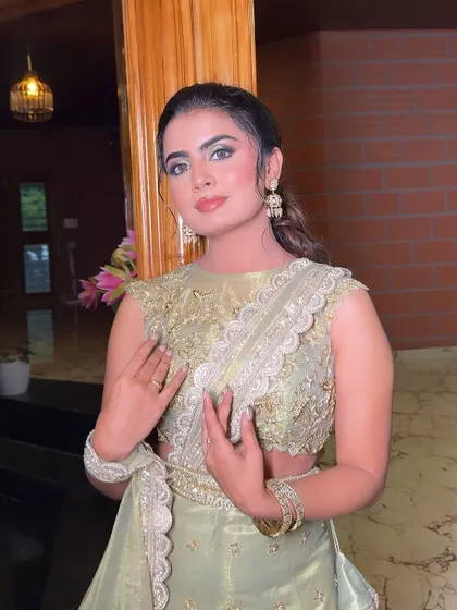 A full look of the client in her beautiful green lehenga, accessorized with our sparkling earrings and bangles.