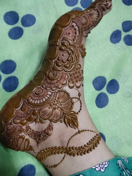 A beautiful foot design in progress, showing how the intricate patterns are carefully built up to create a stunning final piece.