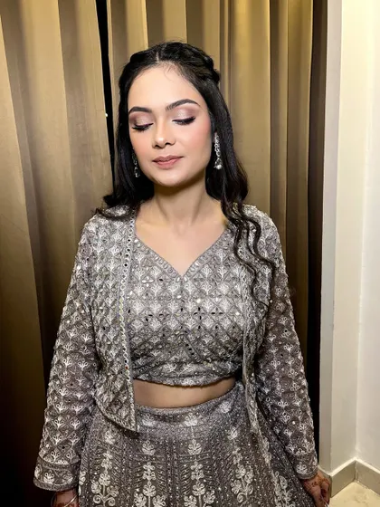 The prettiest 'dulhan ki behen'. We created a very soft shimmer eye with a pink liner, paired with a skin-finish base and nude lips for a fresh and modern look.