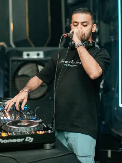 On the mic at Glitte, getting ready to hype the crowd for the next drop.