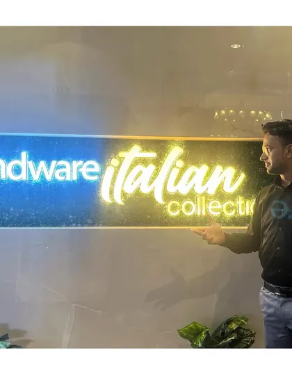 Posing with the glowing Hindware Italian Collection logo. The ambiance of a corporate event is always top-notch.
