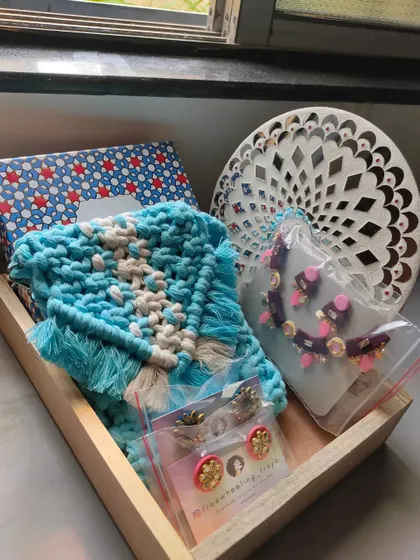 Here is another variation of a custom gift hamper. This one features a beautiful blue macrame purse, a unique necklace set, and some of my signature handmade earrings, all ready to be gifted.