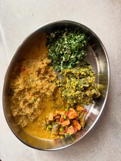 This plate features a fresh raw methi salad, dill dal saaru, and quinoa, showcasing how I incorporate fresh greens and diverse grains into daily meals.