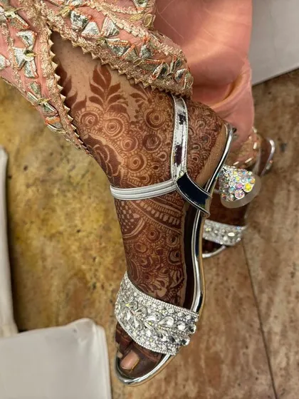A side view of the foot henna stain, showing the detail and rich color.