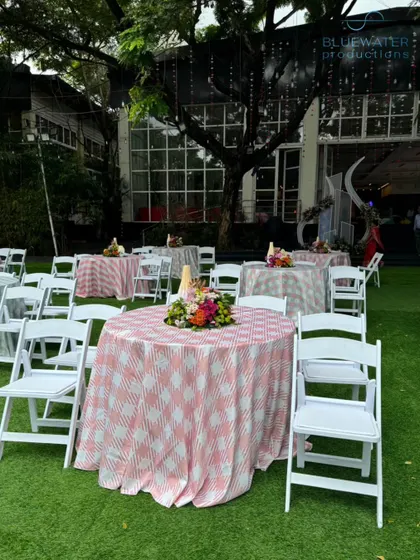 The patterned tables create a vibrant and fun atmosphere for guests to dine and mingle.
