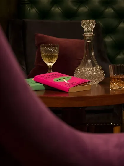 A cozy reading nook, perfect for enjoying a glass of whiskey and a good book.