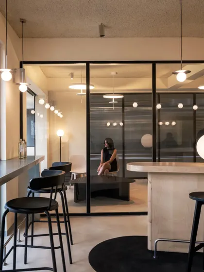 The community table and bar-style seating offer various options for solo visitors or groups.